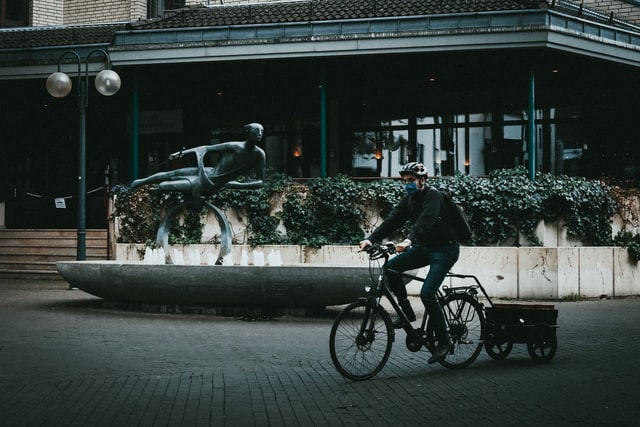 Man riding a bicycle on a public space