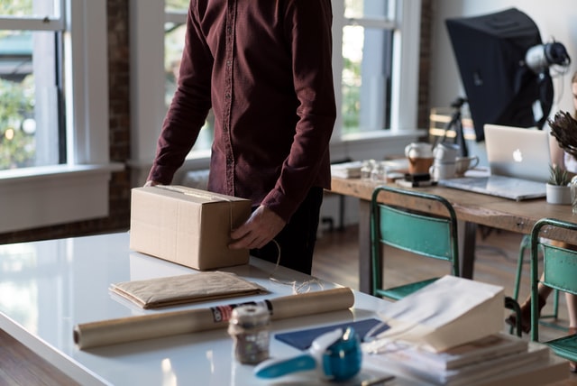 Employee packing a box