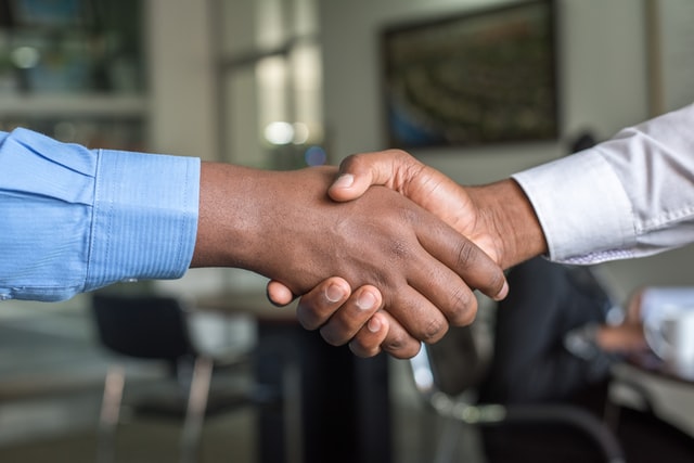 two men shaking hands