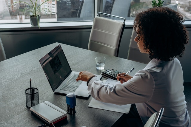 A Woman Working with a Laptop