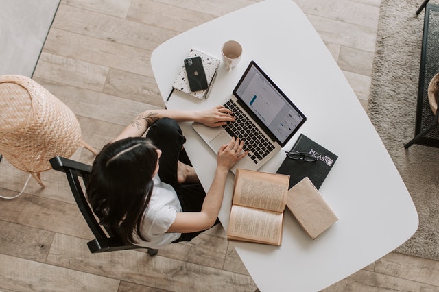 Bird's view of a woman working on her desk.