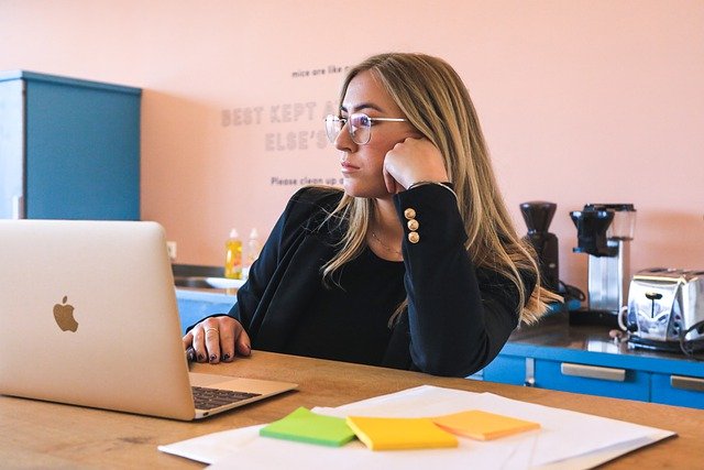 Woman working in front of a laptop