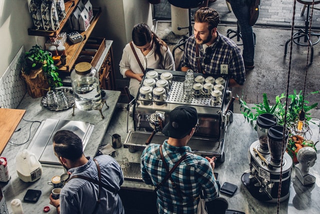 Employees and customers at a coffee shop