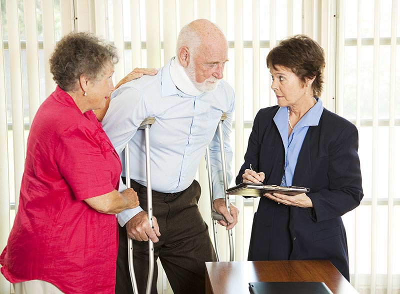 Injured man consulting an attorney about a lawsuit