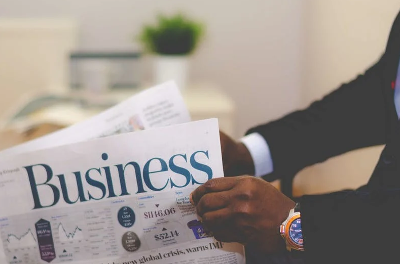 Man reading business newspaper