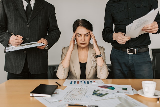 Stressed Elderly Woman making business decisions