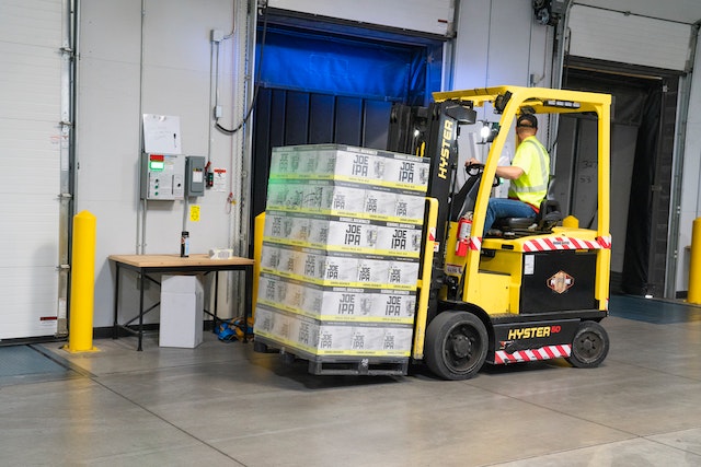 Forklift carrying merchandise