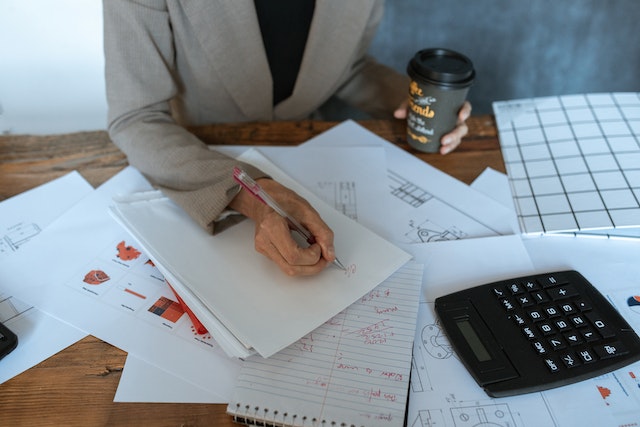 Woman working, doing paper work