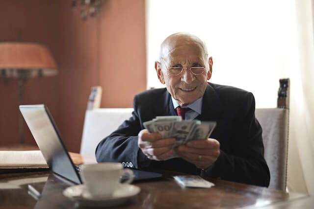 Older man counting money