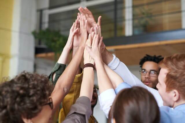 People touching each other's hands.