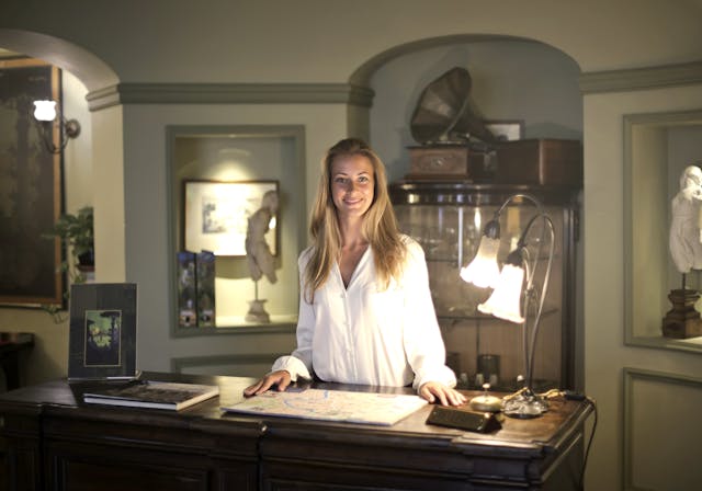 Women at a hotel desk.