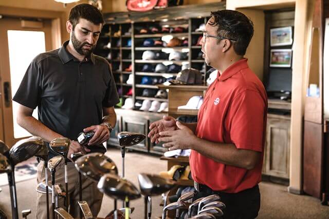 Two men at a golf store