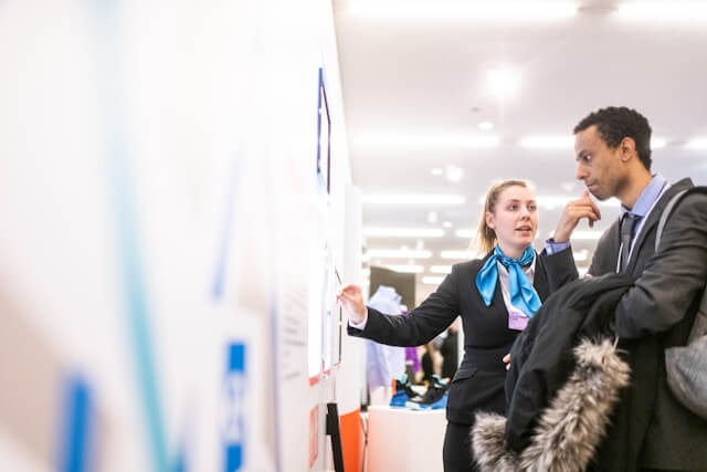 A man and a women talking at work