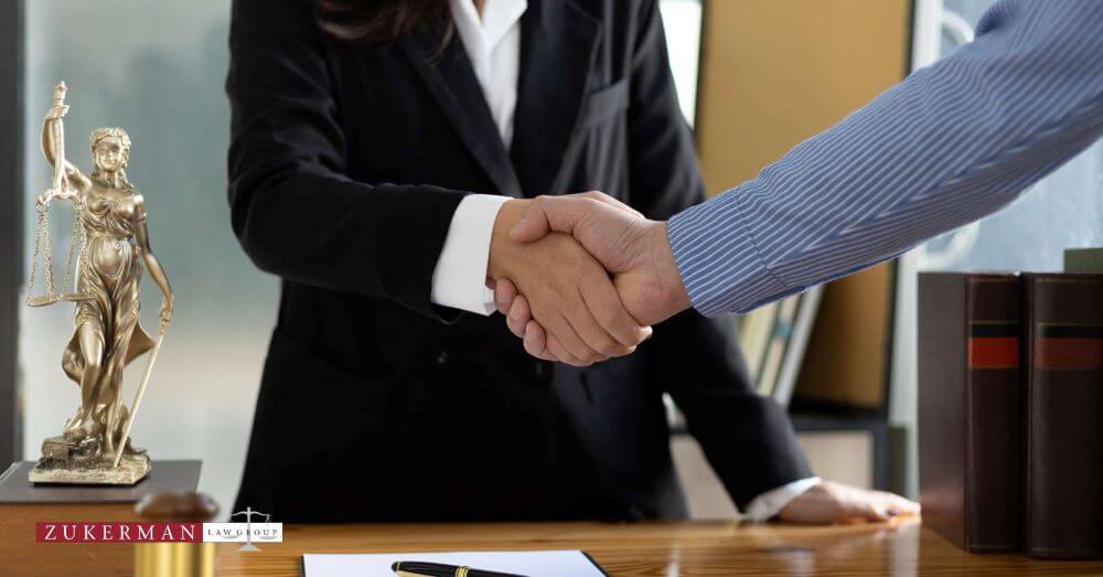 Lawyer and client shaking hands